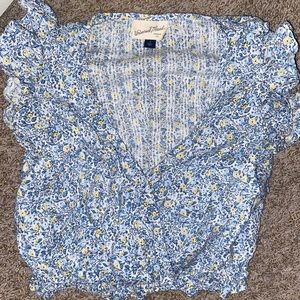 Light and airy summer blouse. Fluffy sleeves, low v-cut with a scrunched hem.